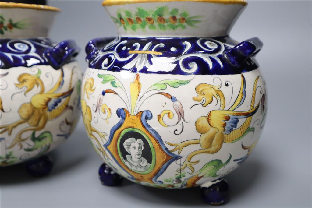 A pair of Urbino style Delft bulbous-bodied two-handled vases, each on three feet, height 18cm